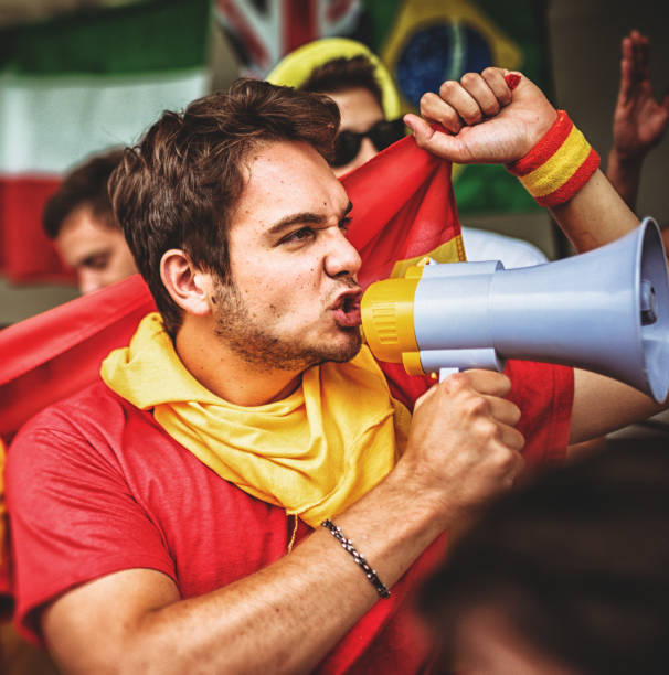 istock spanish supporter with the megaphone 988545600