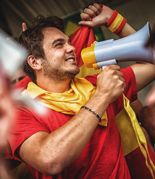 istock spanish supporter with the megaphone 988549554