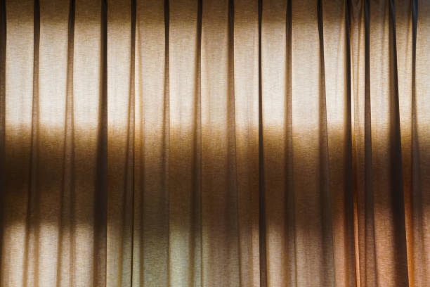 istock curtain in a hotel room and shadow 988585678