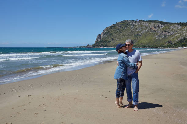 istock Happy Couple On The Beach 988586044