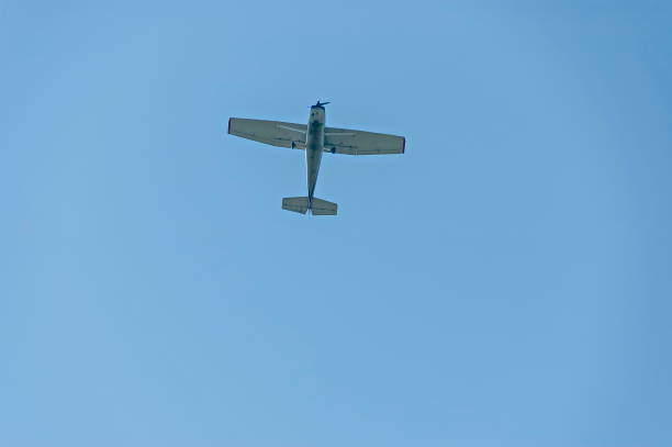 istock Small aeroplane  flying on blue sky background over Sredna Gora mountain 988593668