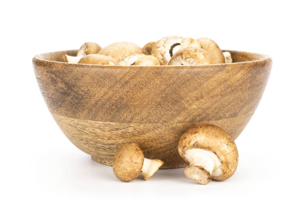 istock Fresh raw brown champignons isolated on white 988618056