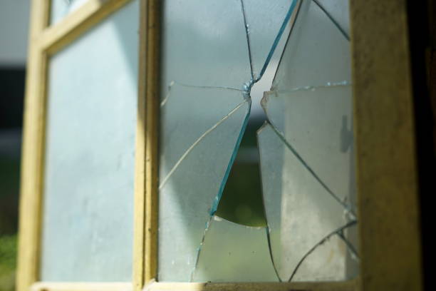 istock Bullet hole in the window 988621554