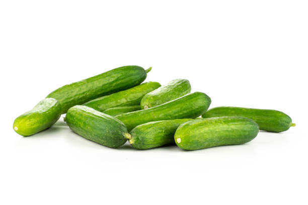 istock Fresh raw mini cucumber isolated on white 988626292