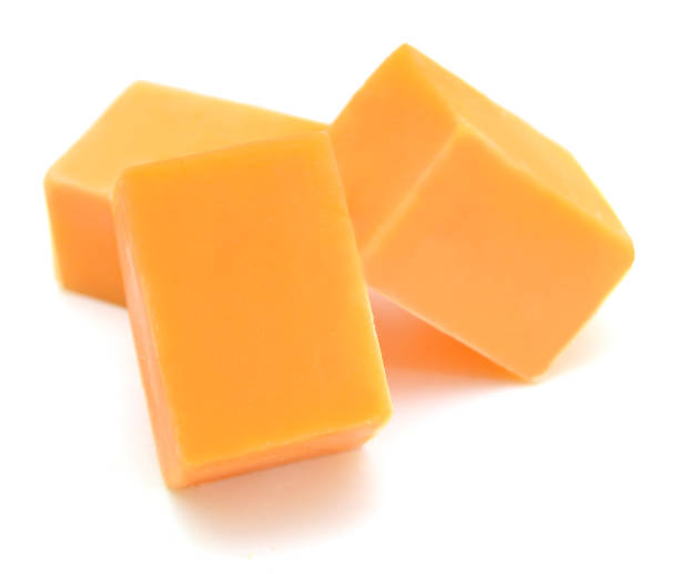 istock piece of cheese isolated on a white background 988644106