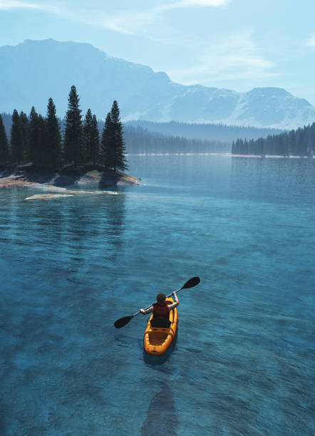 istock Man with canoe on the lake. 988644410
