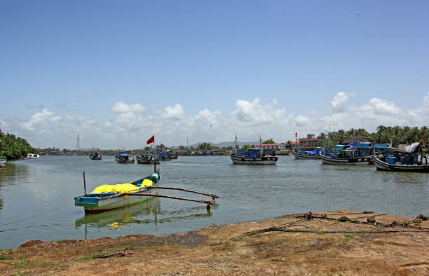 Fishing boats anchored at Cutbon Fishing Jetty along Sal River near Cutbona Jetty in Goa, view from Betul side.
