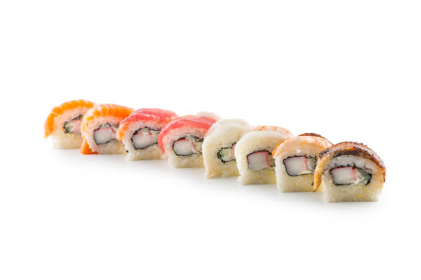 istock Portion of sushi uramaki isolated on white background. 988652310