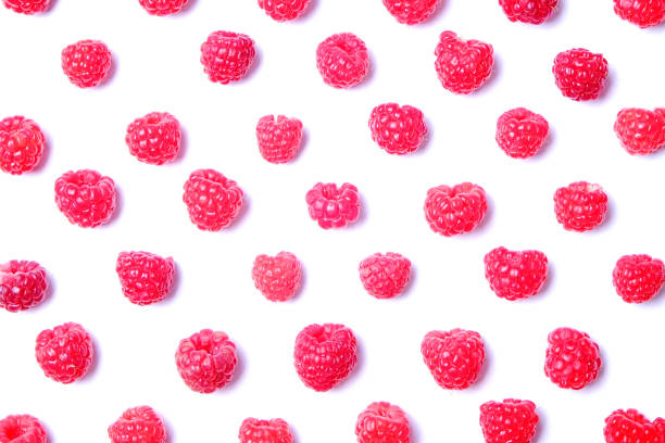 istock Bunch of fresh organic raspberry berries in seamless ornament pattern, white background. Clean eating concept. Healthy nutritious vegan snack, tasty raw diet. Close up, copy space, top view, flat lay. 988664944