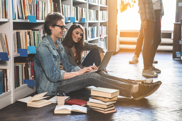 istock Positive man and girl using gadget 988671920
