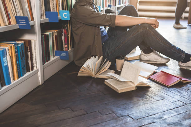 istock Man locating near bookshelf in athenaeum 988674408