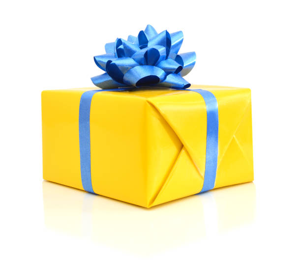 istock gift yellow box with blue ribbon bow close up isolated on white background 988677108