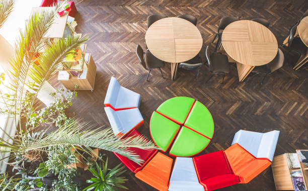 istock Desks and cozy seats in library 988677360