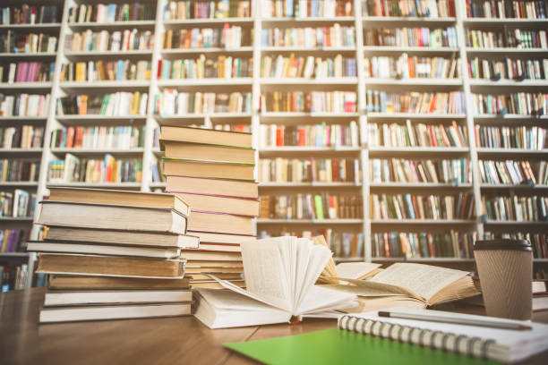 istock Books locating on table and shelves 988681920