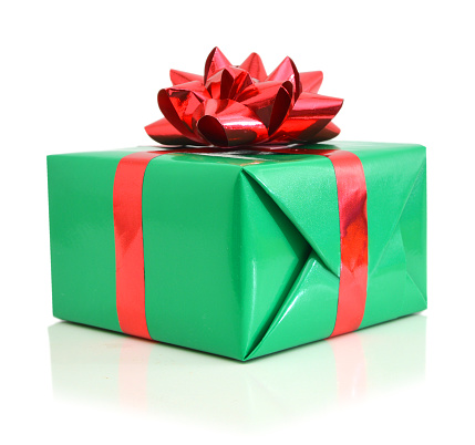 A green gift with a red ribbon and a bow