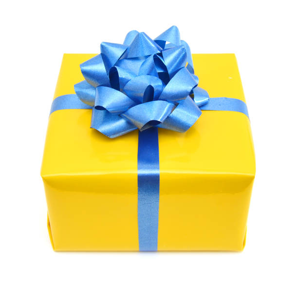 istock gift yellow box with blue ribbon bow close up isolated on white background 988686278