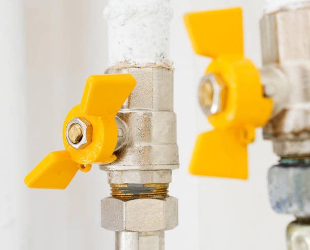 istock Yellow gas shutoff valves at home. 988693666