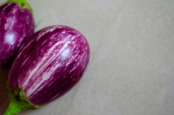 istock Close-up of several purple eggplants 988711642