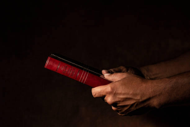 istock Hands holding the Holy Bible 988715738