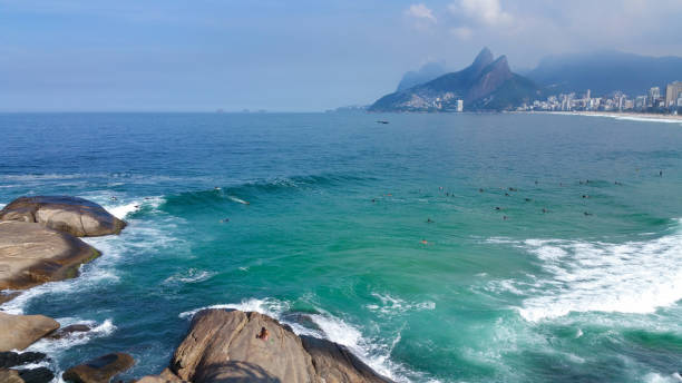istock Summer day at Arpoador beach in Rio de Janeiro Brazil 988718944