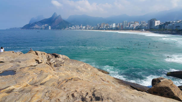 istock Summer day at Arpoador beach in Rio de Janeiro Brazil 988719356