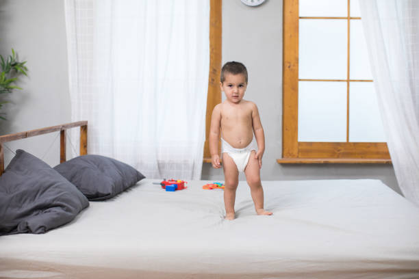 istock Baby boy playing with toys 988719732