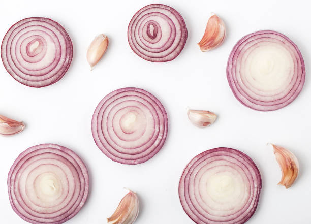 istock Garlic with red onion isolated on white background. Isolated garlic 988719982