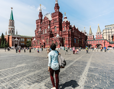 Russia, Moscow, July 17,2023:People walk around Red Square, St. Basil's Cathedral, the Spasskaya Tower and the Kremlin are visible, which are world-famous historical sites of Moscow