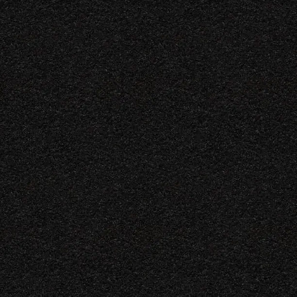 Photo of Black asphalt with fine grain, seamless texture. Close-up of black road background. Perfect repeatable pattern