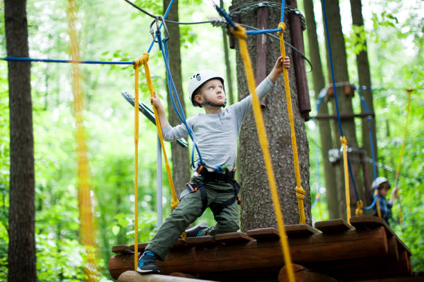 istock The little boy climbing in the rope park 988735484
