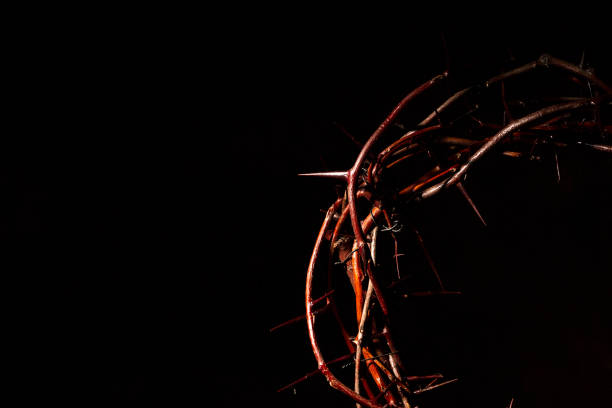 istock Crown of thorns Isolated in the dark 988738382