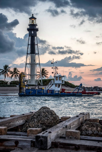 istock Hillsboro Inlet Lighthouse with jetty in the foreground 988756054