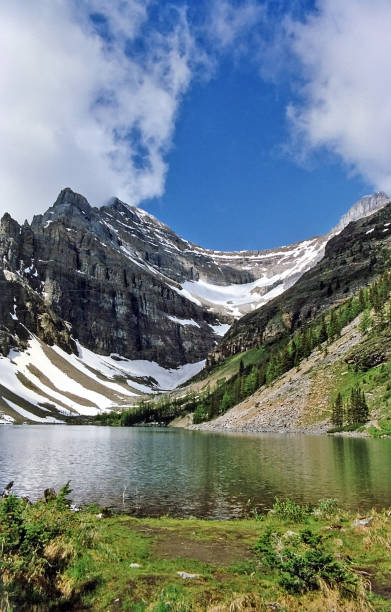 istock Banff area lake in summer with morning reflection 988756442
