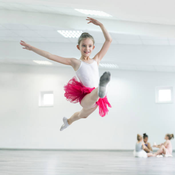 child ballerina on ballet practice - dancer jumping ballet dancer ballet imagens e fotografias de stock