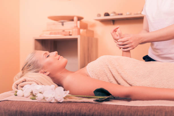 istock Woman having massage in spa salon 988770390