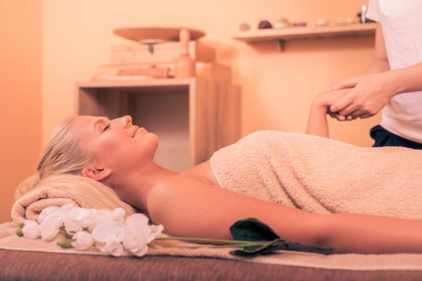 istock Young woman having massage 988770414