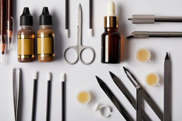 istock top view of various tools and cosmetics for permanent makeup on white 988773614