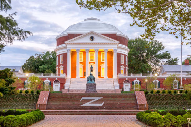 The Rotunda at the University of Virginia at dusk with Thomas Jefferson Statue in the foreground Charlottesville, USA - September 16, 2017: The Rotunda at the University of Virginia at dusk with Thomas Jefferson Statue in the foreground rotunda stock pictures, royalty-free photos & images