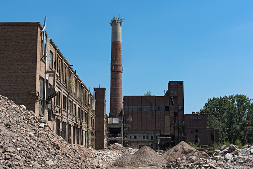 hattersheim am main-okriftel, germany-june 29, 2018: remodeling and partial demolition of a former paper mill, (cellulose factory)