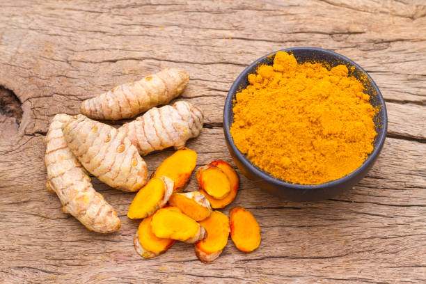 istock powder and roots of turmeric 988805222
