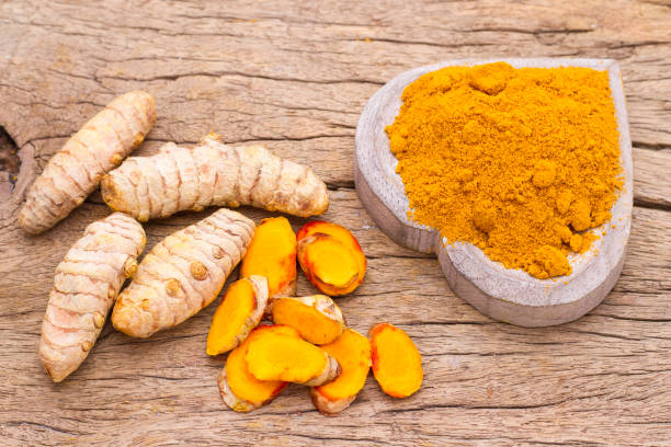 istock powder and roots of turmeric 988805228