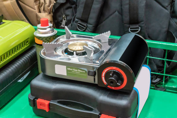 Mini Portable Gas Stove on black hard case ready for travel.