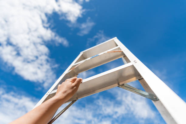 istock Woman Hand Reaching For Red Ladder Leading To A Blue Sky Step by Step. Development Attainment Motivation Career Growth Concept. 988896170