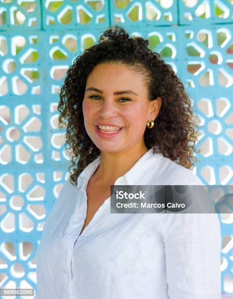 Young Beautiful And Happy Latin Afro Mixed Woman On Her 30s Smiling Cheerful And Posing Fresh Outdoors Isolated On Beautiful Background In Happiness And Success Concept Stock Photo - Download Image Now