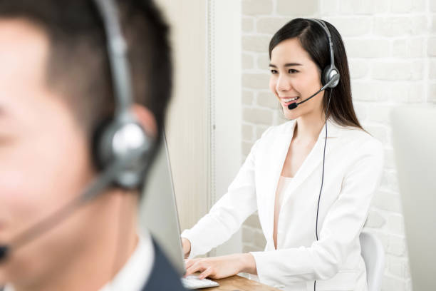 istock Asian woman customer service agent working in call center 989111522