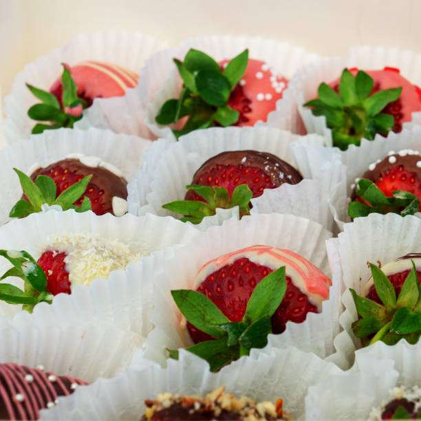 istock Strawberries in chocolate. Sweets for a gift. 989180580