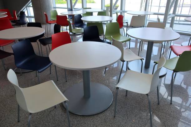 istock Colorful plastic chairs and tables 989185628