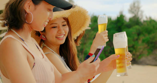 istock Young people having fun on the beach. 989186170
