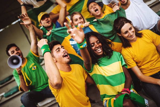 istock brazilian supporters have fun at the stadium 989193344