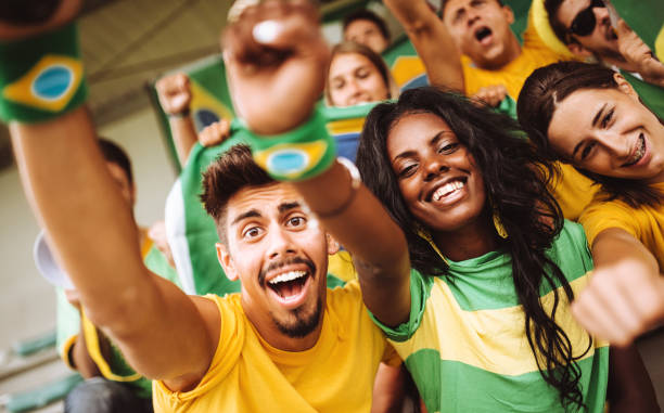 istock brazilian supporters have fun at the stadium 989194644